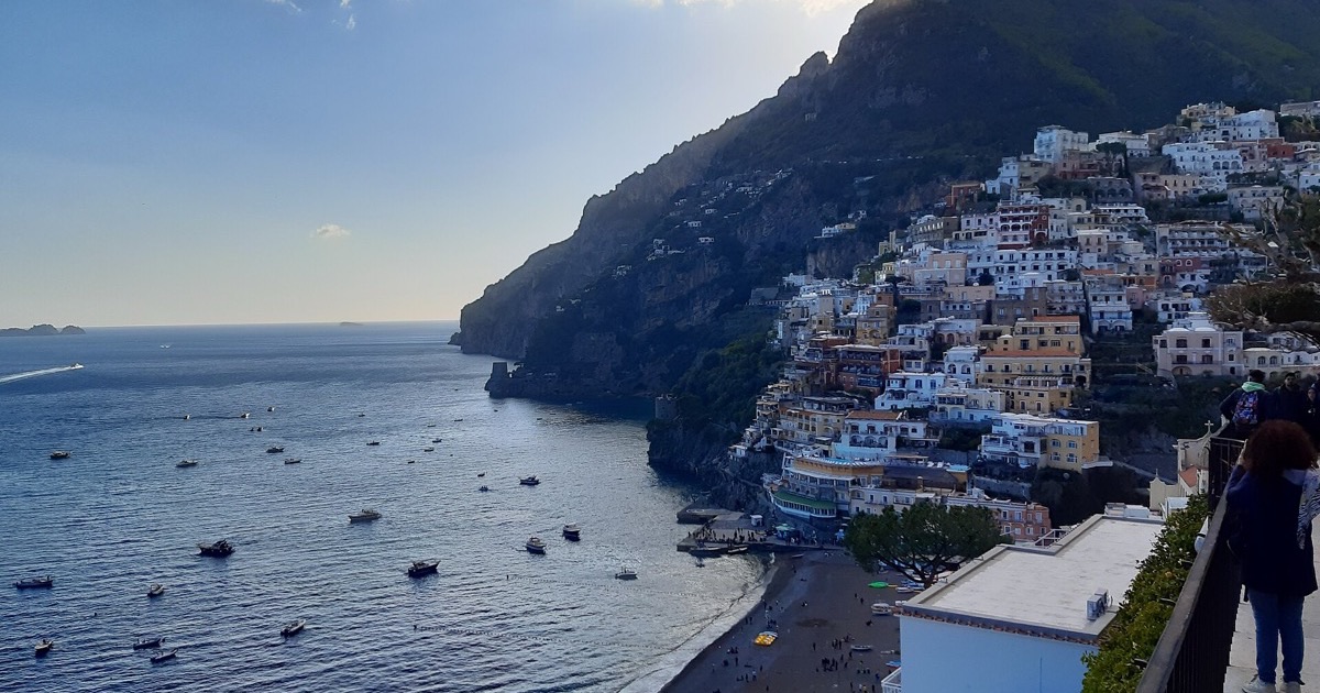 The cliffside pastel houses of Positano on Italy's Amalfi Coast at dusk