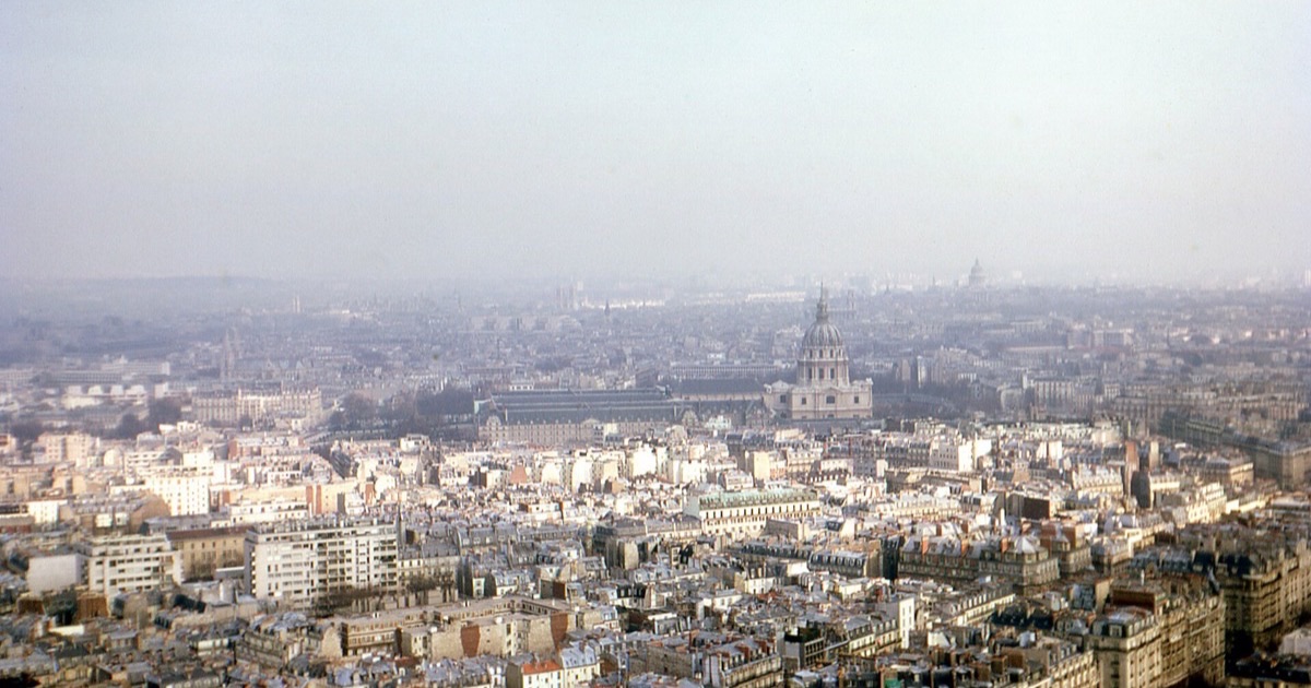 Aerial view over the rooftops of Paris with the dome of Les Invalides